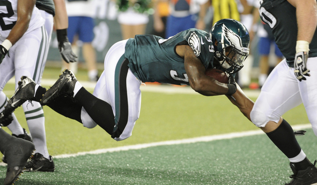 Matthew Tucker dives into the end zone to score against the Jets.